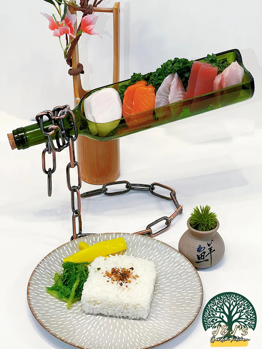 Sashimi platter in a repurposed wine bottle stand, served with rice, pickles, and seaweed at J&J's Garden Kitchen，a Asian Restaurant in Fredericksburg