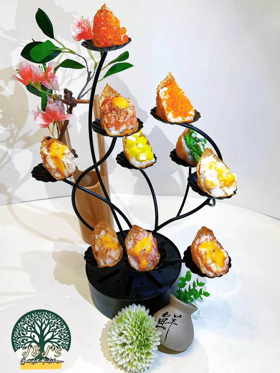 Tree-shaped stand with assorted inari sushi topped with salmon roe, egg yolk at J&J's Garden Kitchen，a Asian Restaurant in Fredericksburg